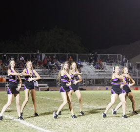 qchs cheerleaders on the football field