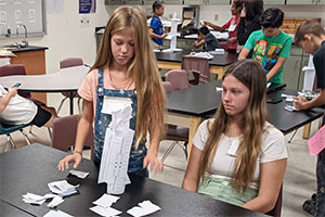 Students making a paper tower