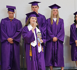 Graduate speaking to students
