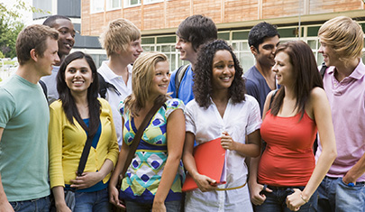 Group of students talking outside of school