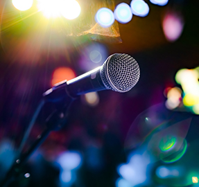 microphone on stage with colorful lights